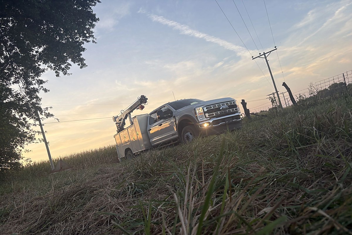 VOLTS service truck in the field at dusk