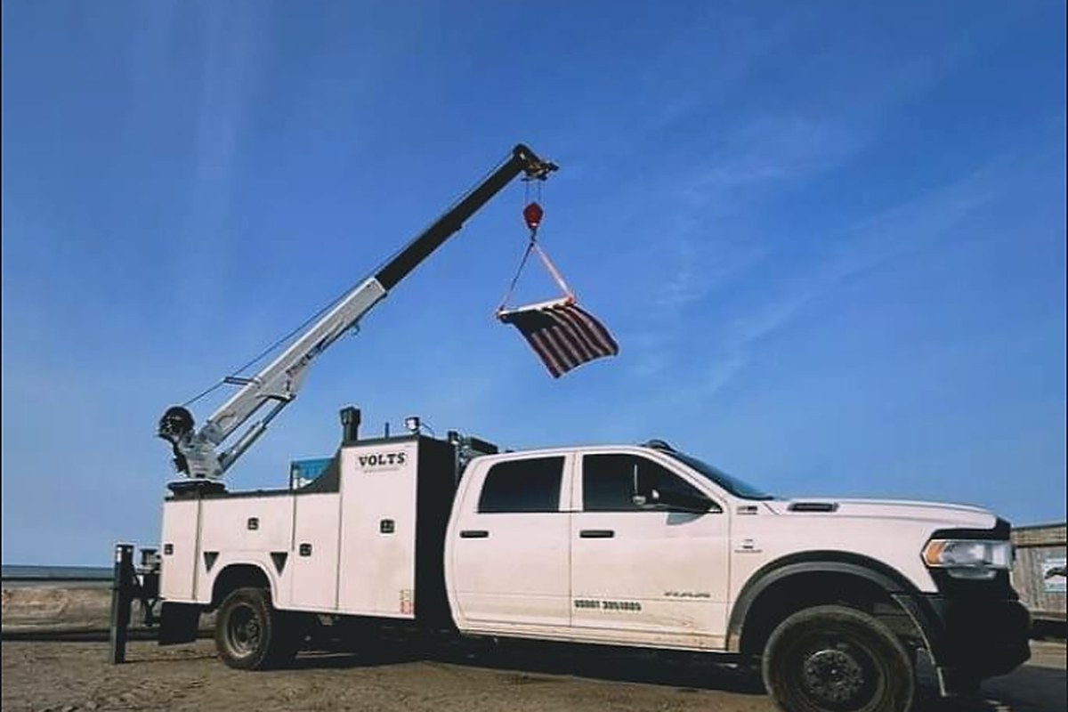 VOLTS crane service truck with boom deployed