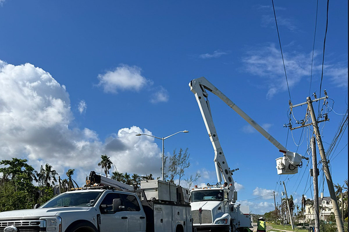 VOLTS service truck and bucket truck restoring a storm-damaged line
